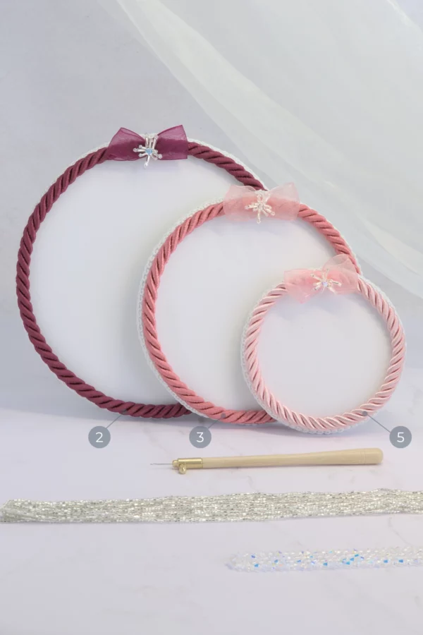 Set of three pink Starlight embroidery beading plates with Lunéville hook and beads, perfect for haute couture embroidery.