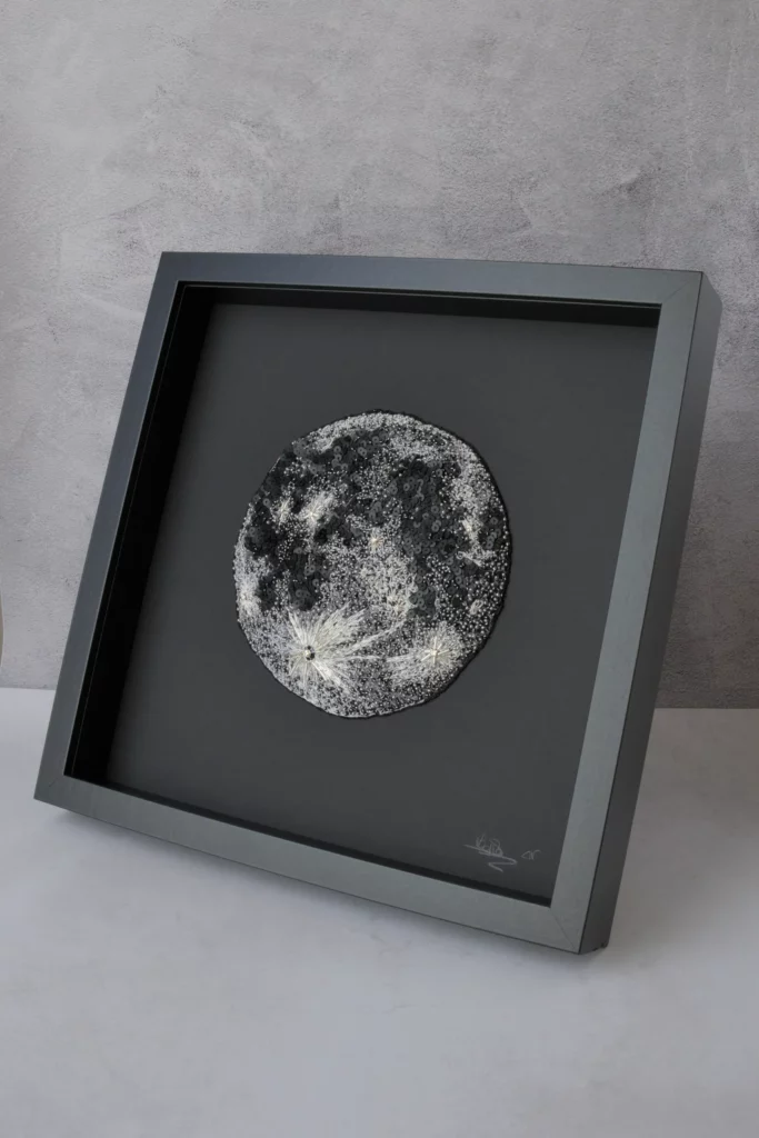 Fine embroidered moon artwork, showcasing fine embroidery and textile art from an embroidery studio in Toulouse, France.