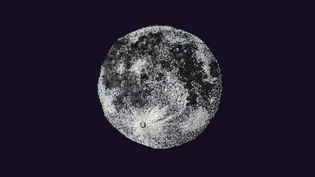 Fine embroidered moon artwork, showcasing fine embroidery and textile art from an embroidery studio in Toulouse, France.