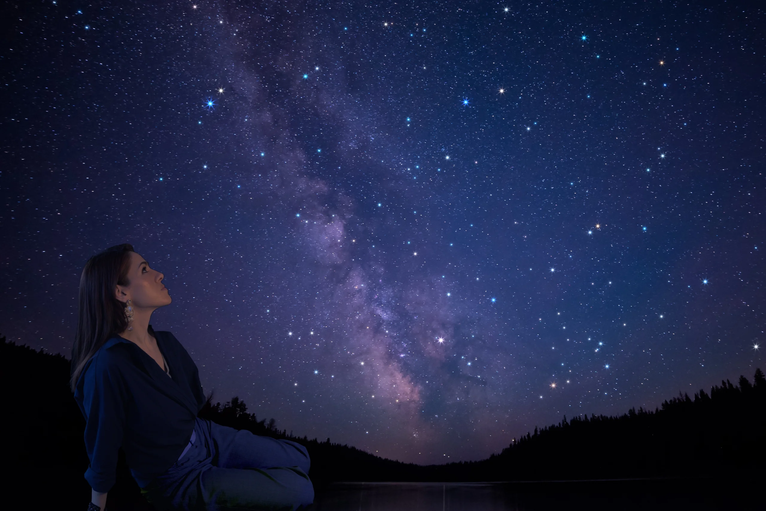 Artist looking at a starry sky, inspired by science and curiosity, reflecting on creativity and embroidery art.
