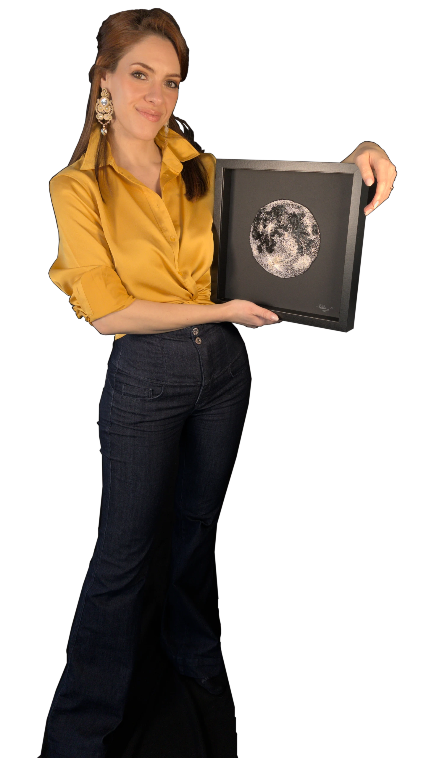 Laura S. Urbina holding a fully hand-embroidered artwork of the Moon, showcasing bespoke embroidery and artistic textile design.