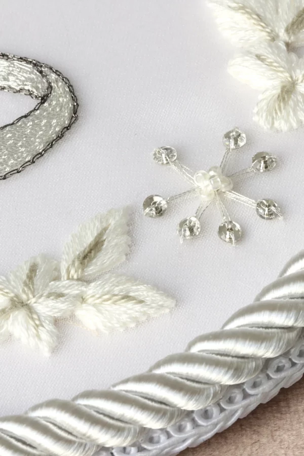 Bespoke embroidered wedding ring holder, custom-designed to complement the bride’s gown embroidery for a timeless wedding accessory.