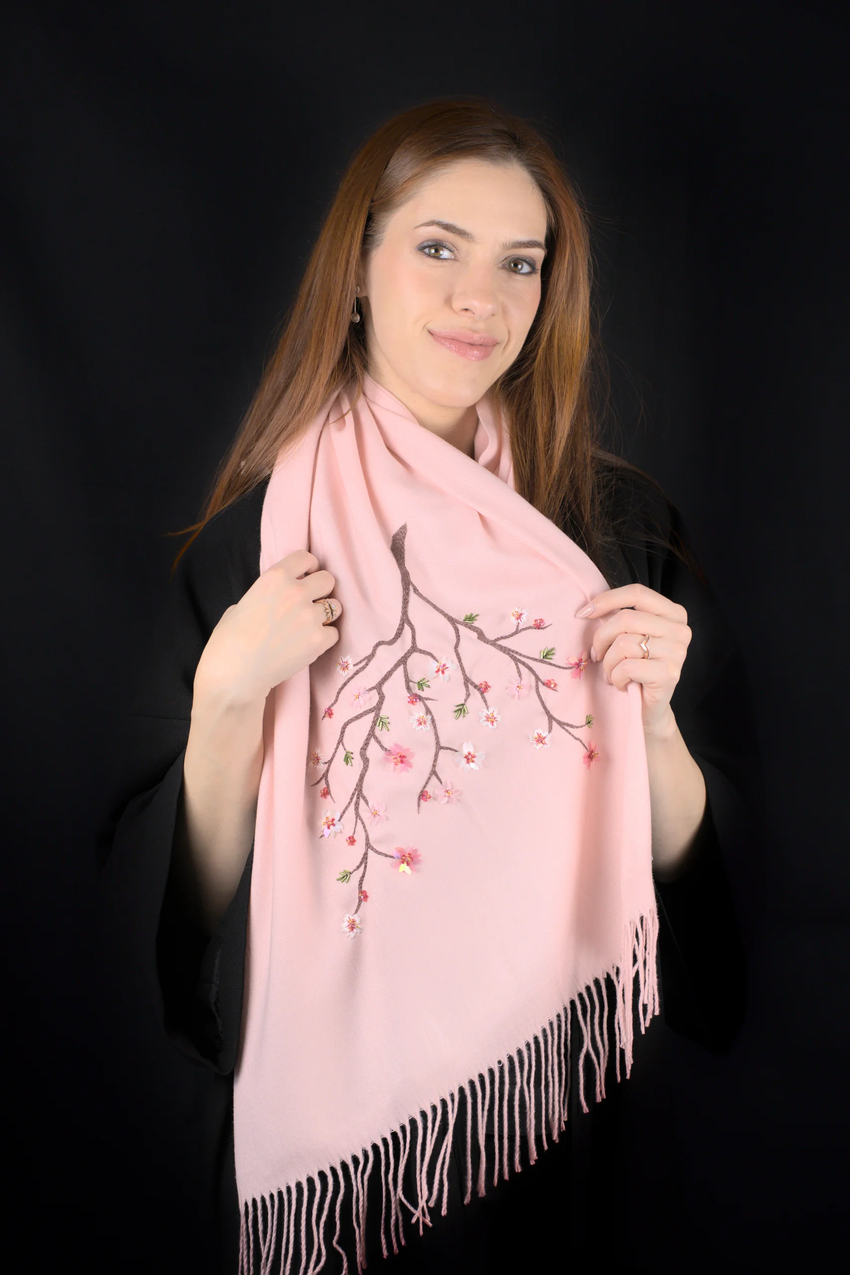 Maia Pleiades cashmere scarf model portrait, highlighting cherry blossom embroidery and soft pink cashmere.