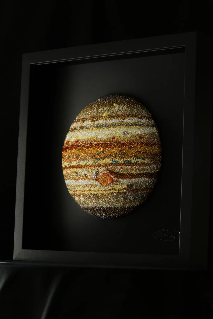 Original framed Jupiter artwork hand embroidered by Laura S. Urbina with crystals and beads.